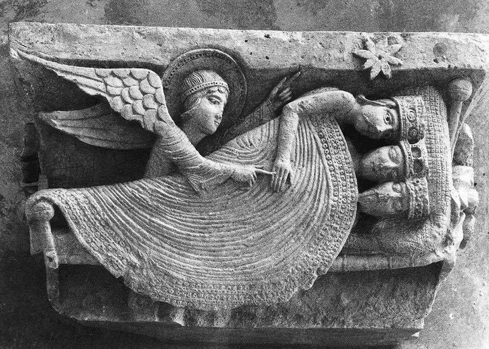 church relief of angel waking three kings sharing a bed